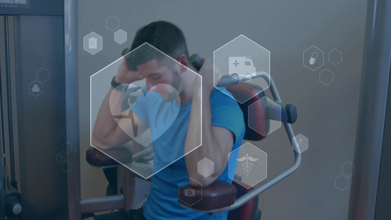 체육관에서 운동하는 백인 남성 위에 의료 및 건강 아이콘의 애니메이션
