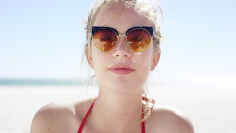 Close-up-portrait-of-beautiful-young-teenage-girl-smiling-on-tropical-beach-slow-motion