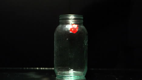 dice falling into glass jar