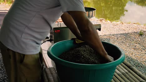 closeup-of-Asian-man-mixing-seeds-such-as-pumpkin-seeds,-gunks,-cur,-cumin