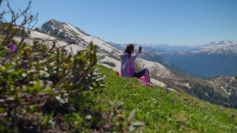 woman taking selfie in the mountains