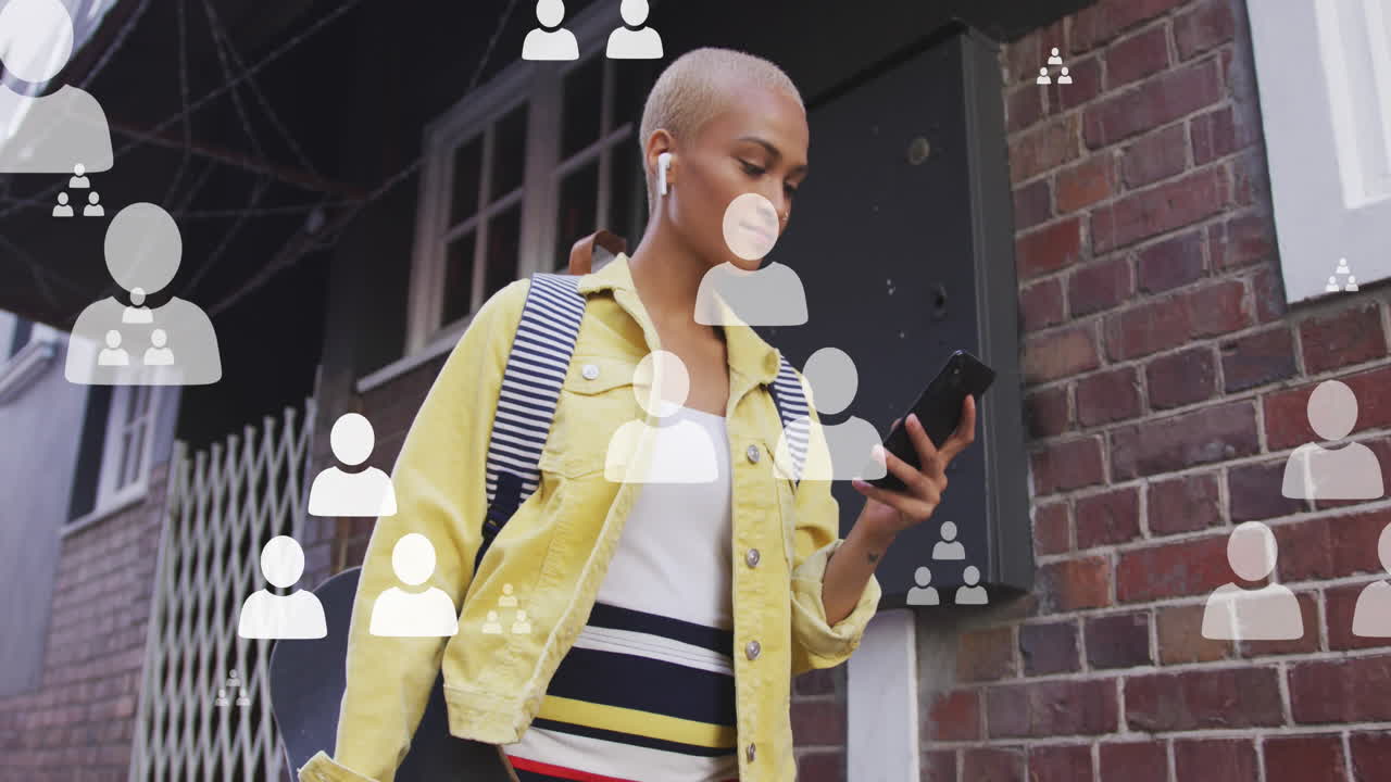 Animation of social media icons over biracial woman using smartphone