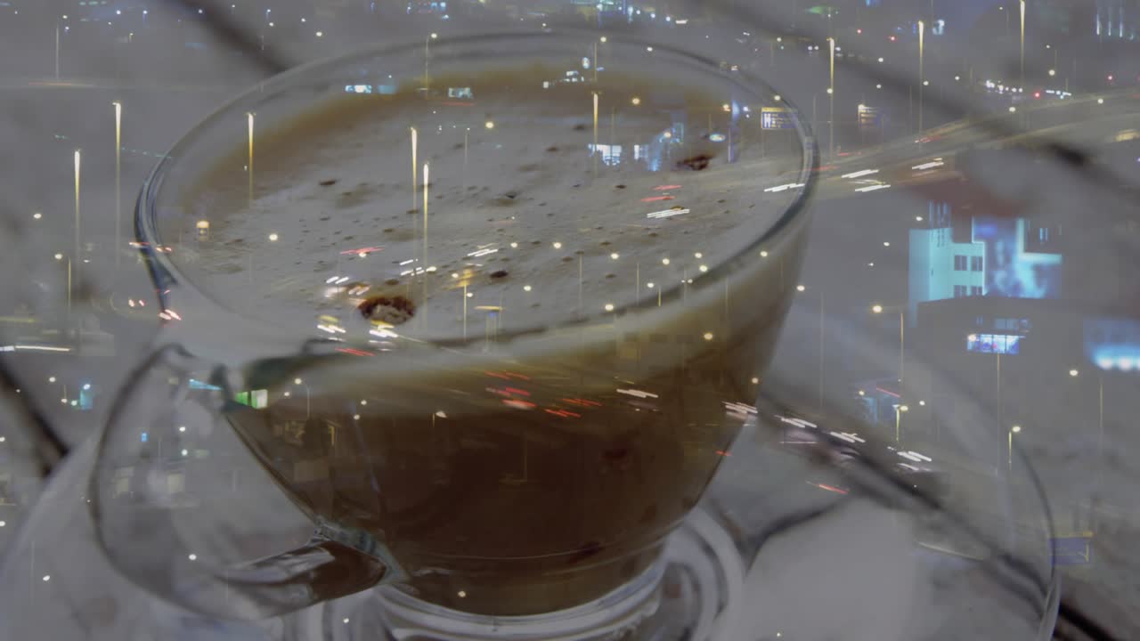 Camera moving closer, glass cup revealing foam crema while city lights streaking, showing contrast
