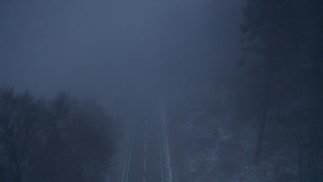 foggy mountain road at night