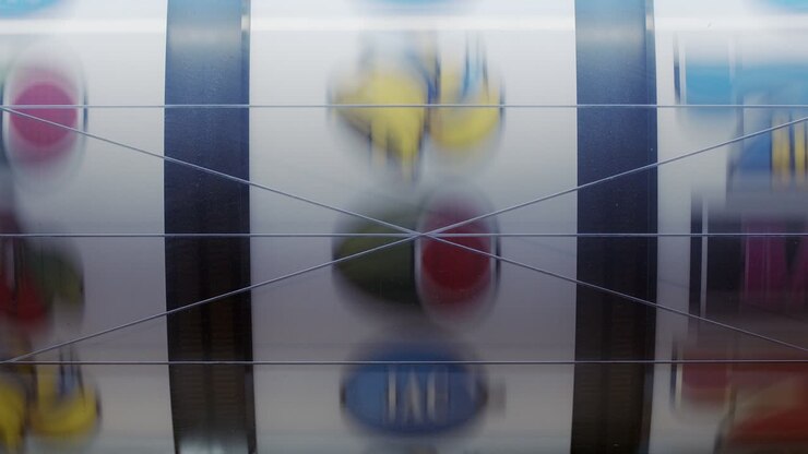 Slot machine in a close up shot of the spinning symbols to a stop of each column of the symbols