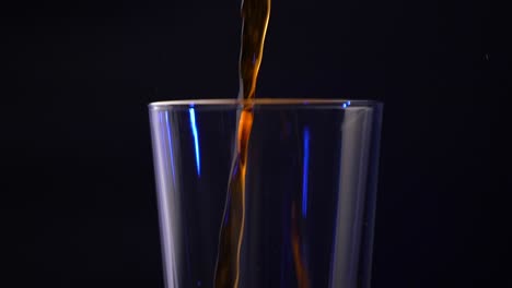 Iced-coffee-being-poured-into-a-pint-glass