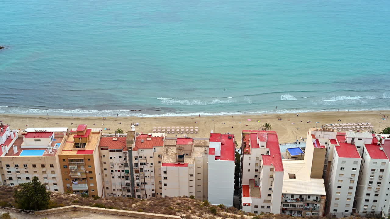 View of a beach and buildings on the shoreline in Alicante, Spain