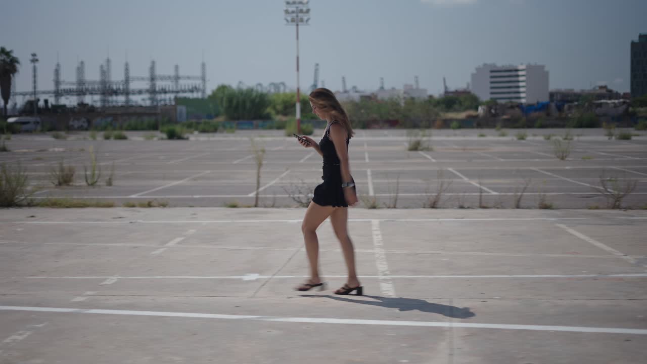 Woman Walking in an Empty Parking Lot