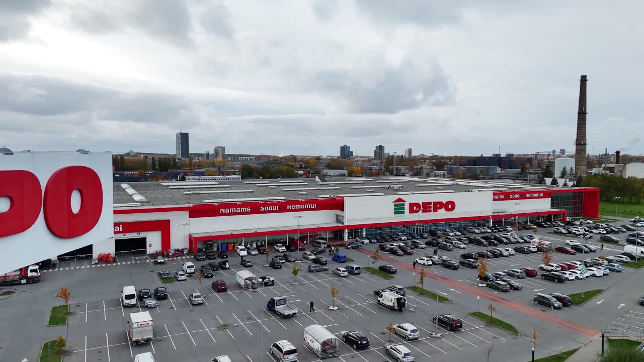 DEPO warehouse and parking lot on a cloudy day in Klaipeda Lithuania aerial view