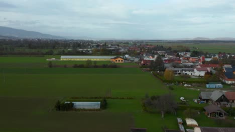 Aerial-view-of-Podova,-Brezula-and-Race,-rural-villages-in-eastern-Slovenia,-south-of-the-city-Maribor-in-the-Pannonian-flatlands,-Drava-river-plain