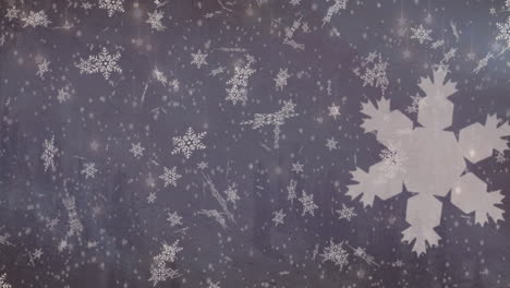 animation of white particles and snowflakes falling with copy space against purple background