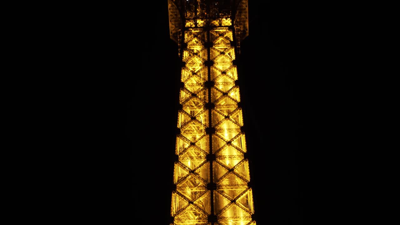 Eiffel Tower Illuminated At The Evening In The City Of Paris, France