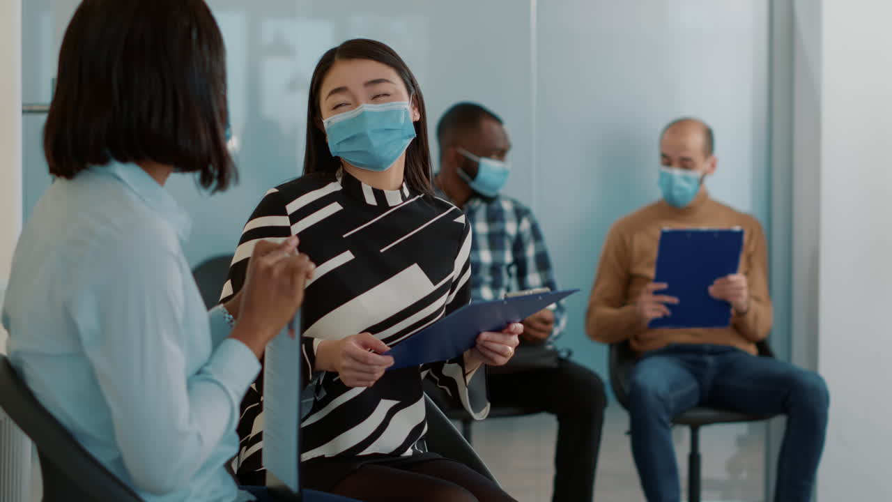 Candidates with face mask waiting to join job interview meeting