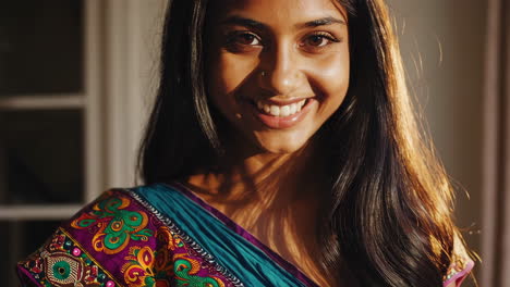 captivating portrait of a smiling south asian woman in traditional attire