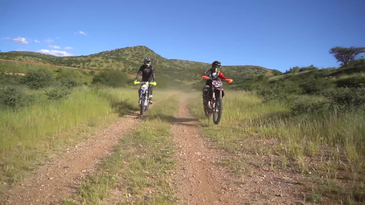 Two Dirt Bike Riders on a Scenic Off-Road Trail