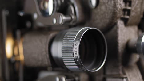 macro shot of 8mm projector lens showing an old film reel