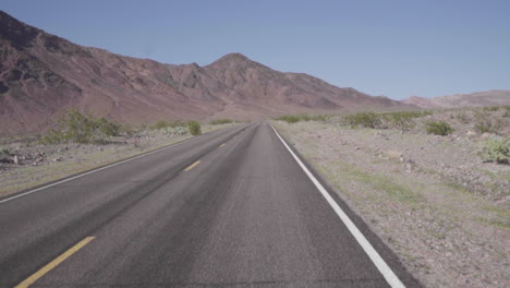 driving along a desert road slow motion