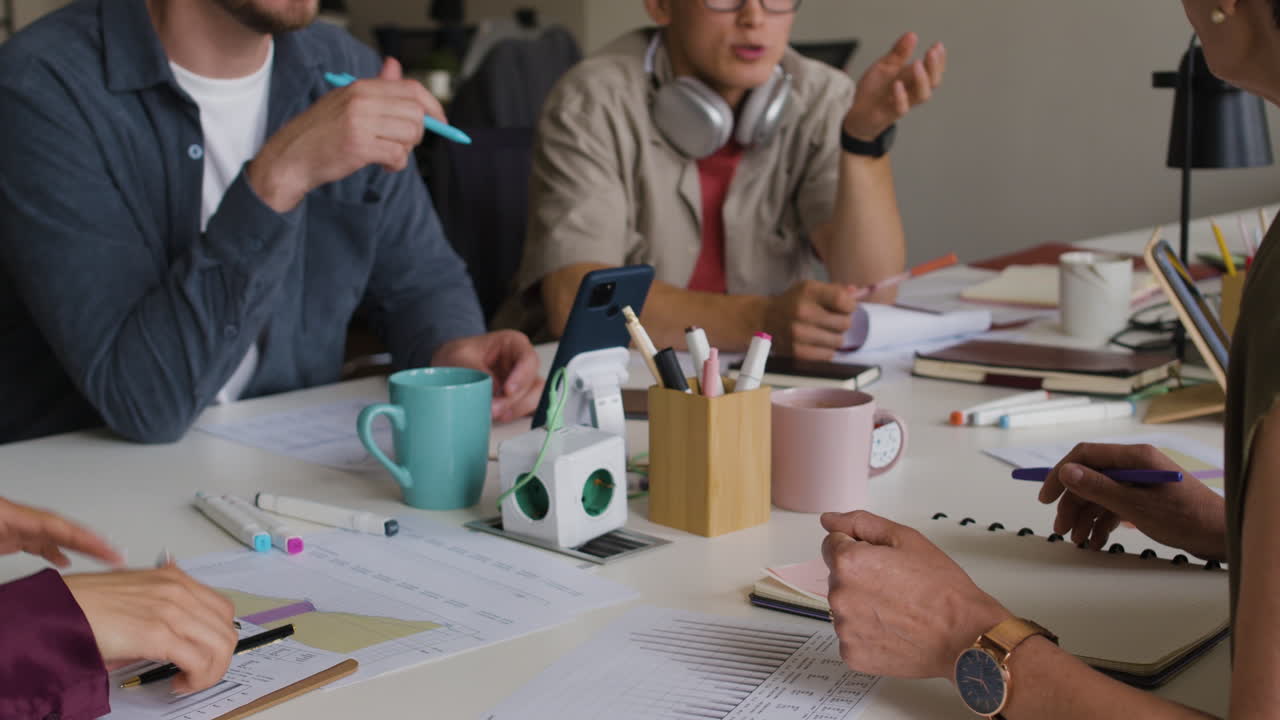 Group of diverse people clapping and applauding during a meeting