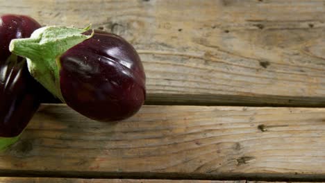 two eggplant on wooden table 4k