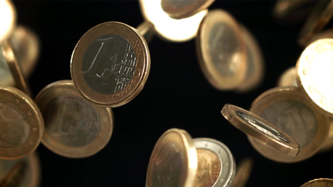 Slow Motion Euro Coins Falling and Floating on Black