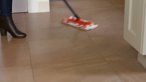 woman using the mop for cleaning