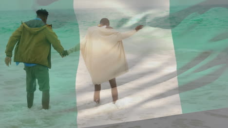 walking in ocean waves, couple with flag animation overlay in background