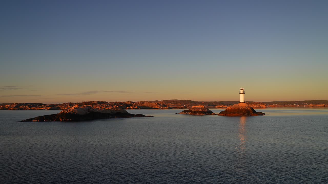 Ursholmen Lighthouse reflection golden hour winter Arctic sunlight sunset ferry boat ride Scandinavia islands Ytre Hvaler National Park Strömstad Stromstad Oslo Fjord Sweden Sverige Norway Norge