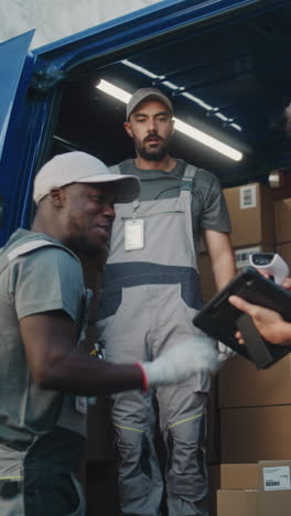 delivery team loading packages into a van