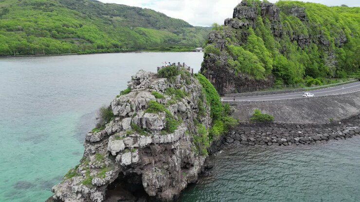 View of Cape with captain Matthew Flinders monument and Indian ocean, Mauritius, Africa