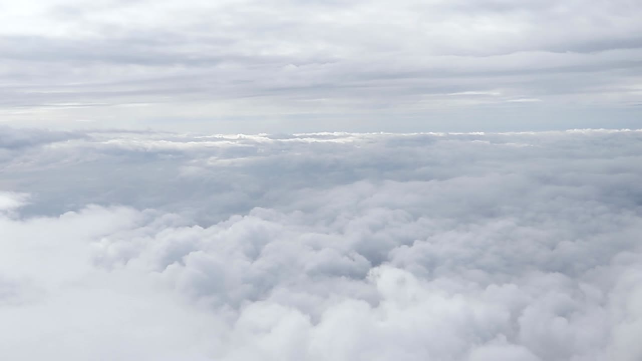 Flight Over the Clouds, Cloudscape aerial view from a plane