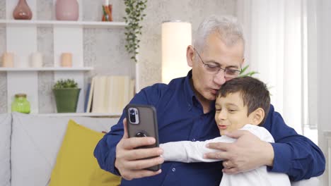 Father-and-son-video-chat-on-the-phone-together.