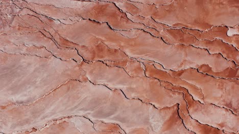 red layers made of volcanic sulfur, drying volcanic sediment, top down