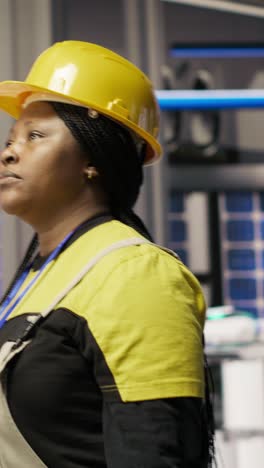 vertical video mechanic holding toolbox walking in smart factory, preparing to do maintenance