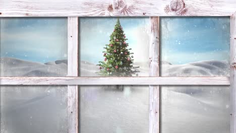 Wooden-window-frame-against-snow-falling-over-christmas-tree-on-winter-landscape