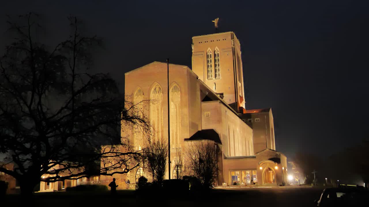 Eastern view of Guildford Cathedral, illuminated by powerful spotlights against the night sky