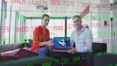 animation of trading board over diverse coworkers discussing 3d model of house on laptop