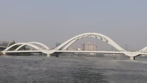 white arch bridge over a river