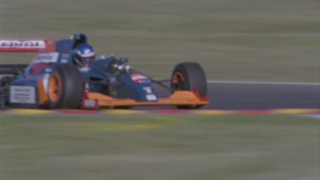 a formula car drives on a circuit track 9