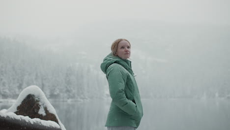 woman enjoying a snowy winter landscape