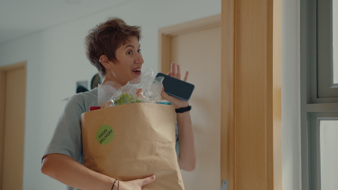 Woman Receiving Food Delivery and Paying Online with Phone
