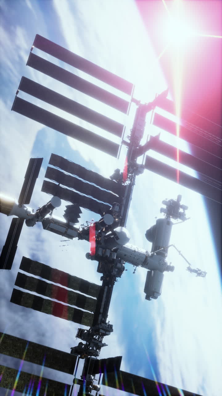 Iss orbits earth with sunlight in the background