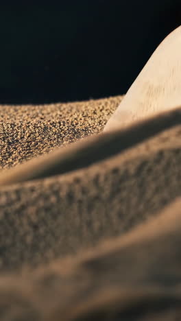 close-up of sand pouring and moving