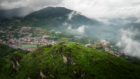 ham rong or dragon’s jaw mountain range with sapa town in background, vietnam