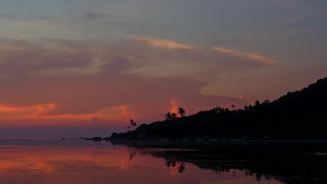 sunset over tropical coastline