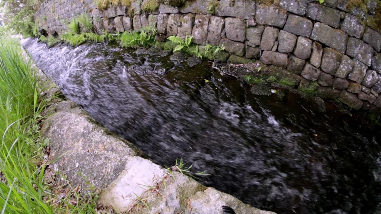 Running river in the english country side shot with a wide angle lens