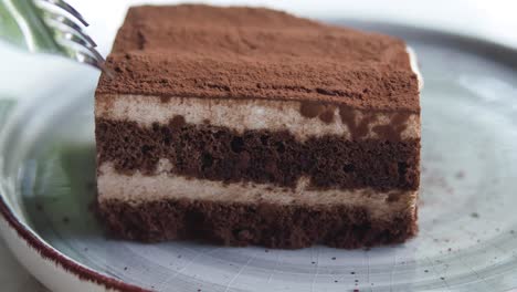 tiramisu slice being eaten