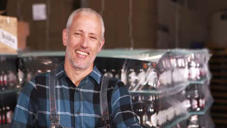 smiling brewery worker preparing orders