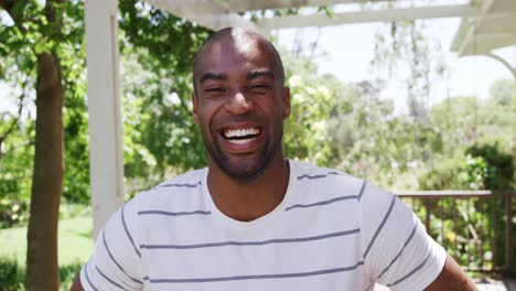 Mixed-race-man-smiling-at-camera