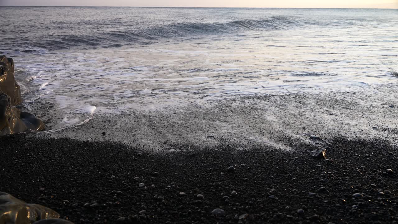 waves and it's dissapearence on the black sand beach, Iceland