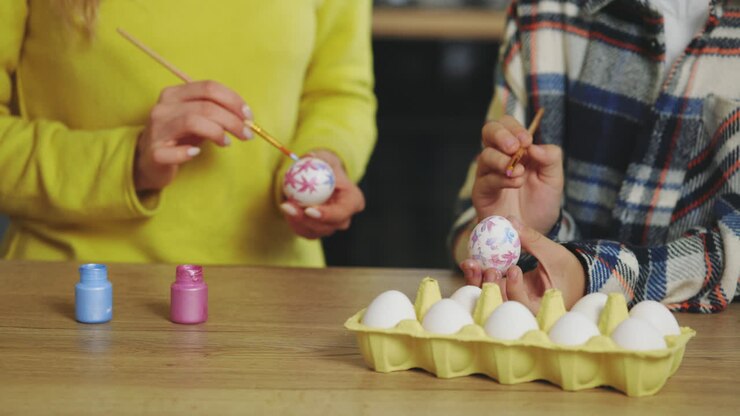 Mom and Child Painting Easter Eggs